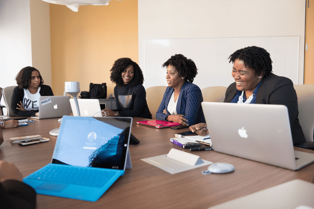 a group of black women in the boardroom